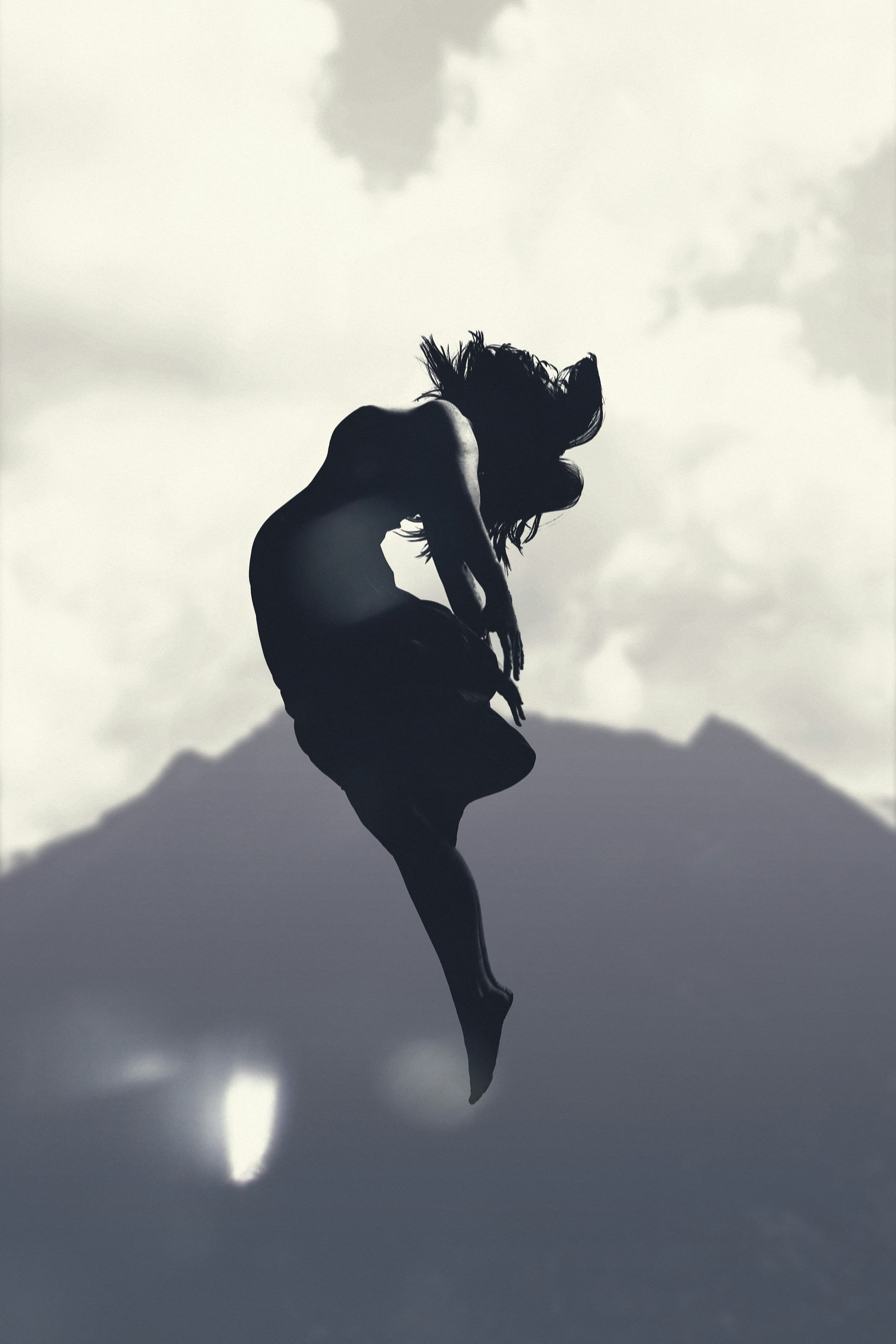 A woman breaking jumping to symbolize breaking free