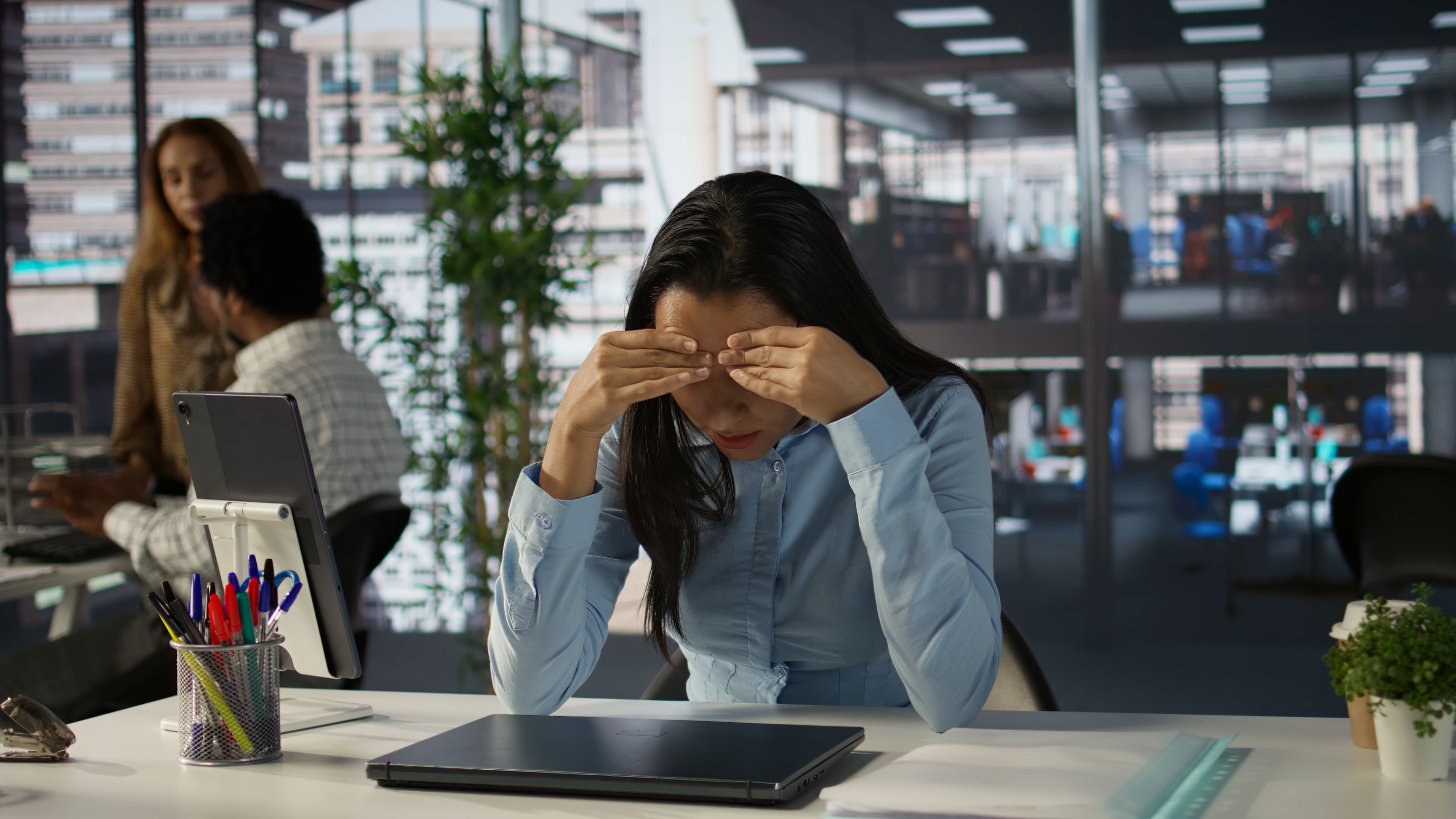 a working woman suffering from burnout in office
